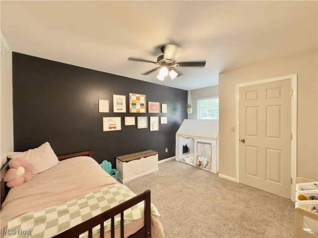 Bedroom with carpet flooring and a ceiling fan