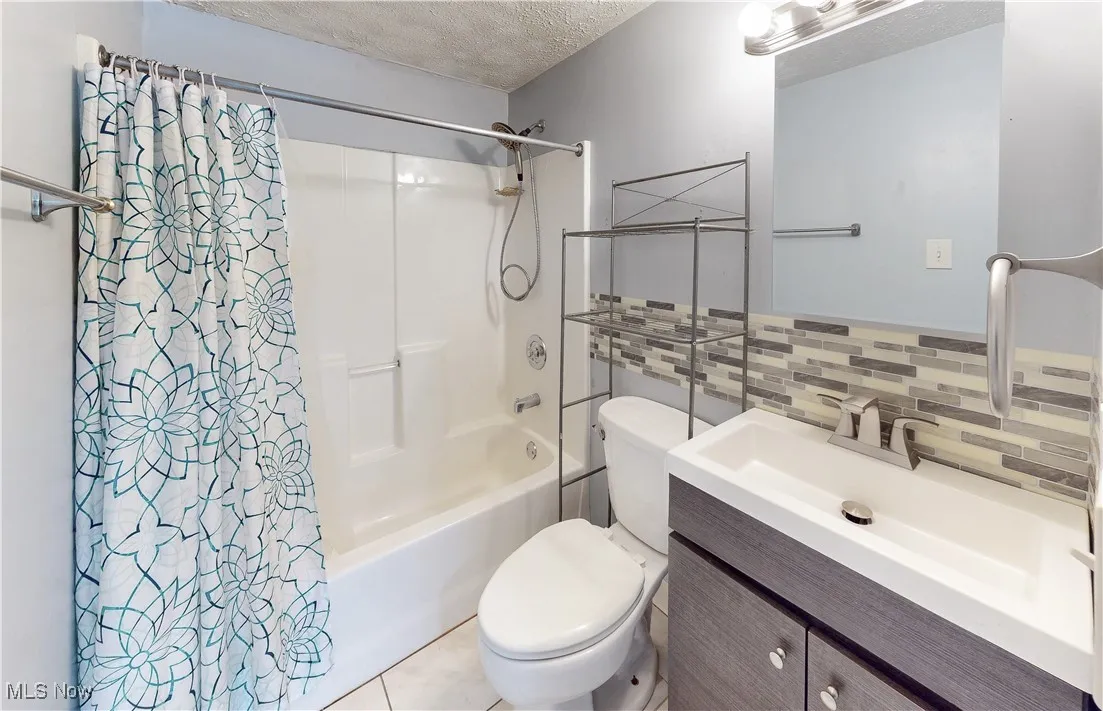 UPDATED BATHROOM WITH NEWER VANITY & MEDICINE CABINET.