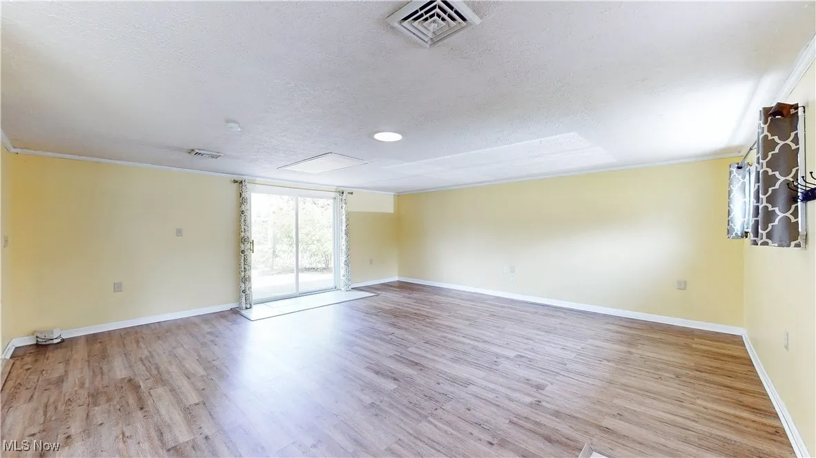 FAMILY ROOM WITH FRESH PAINT & UPDATED FLOORING.