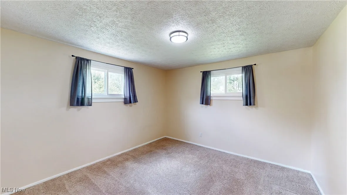 BEDROOM 3. FRESH PAINT & NEUTRAL CARPETING.