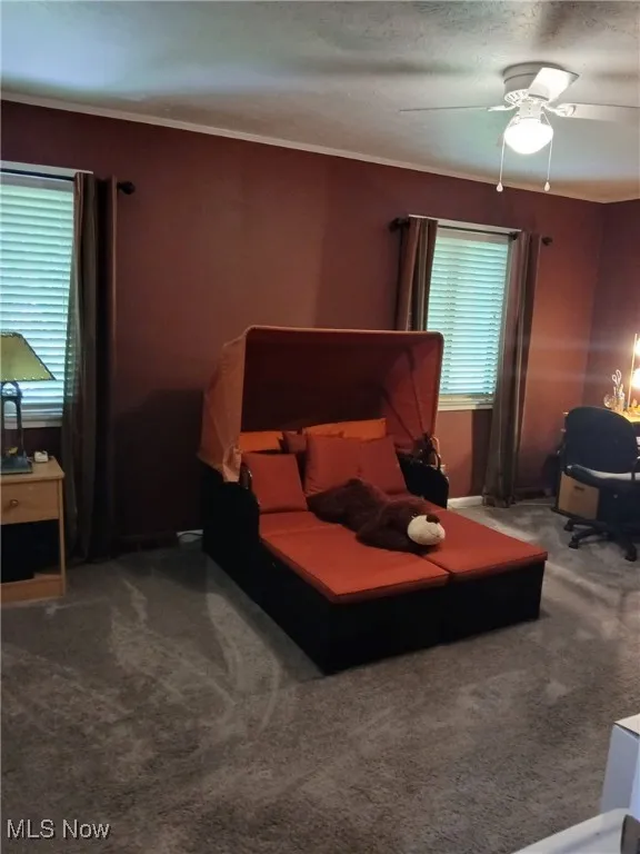Bedroom featuring carpet flooring and ceiling fan