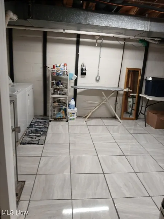 Basement featuring independent washer and dryer
