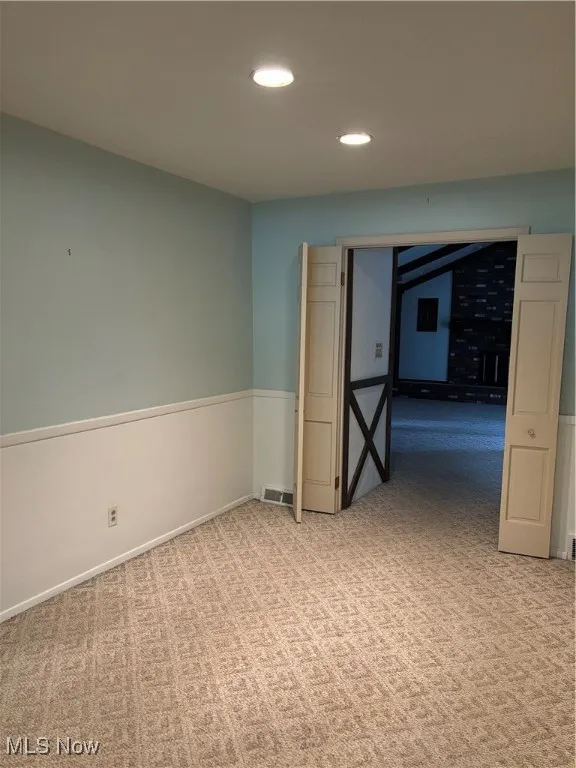 Basement with carpet and recessed lighting