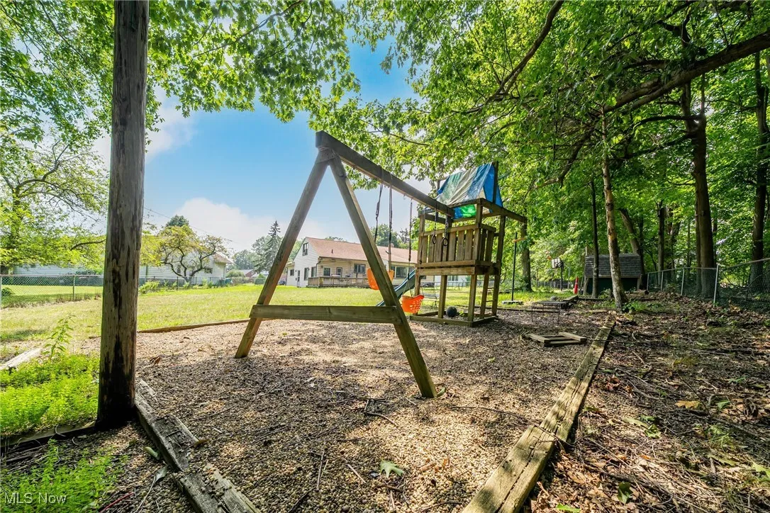 View of play area featuring a yard