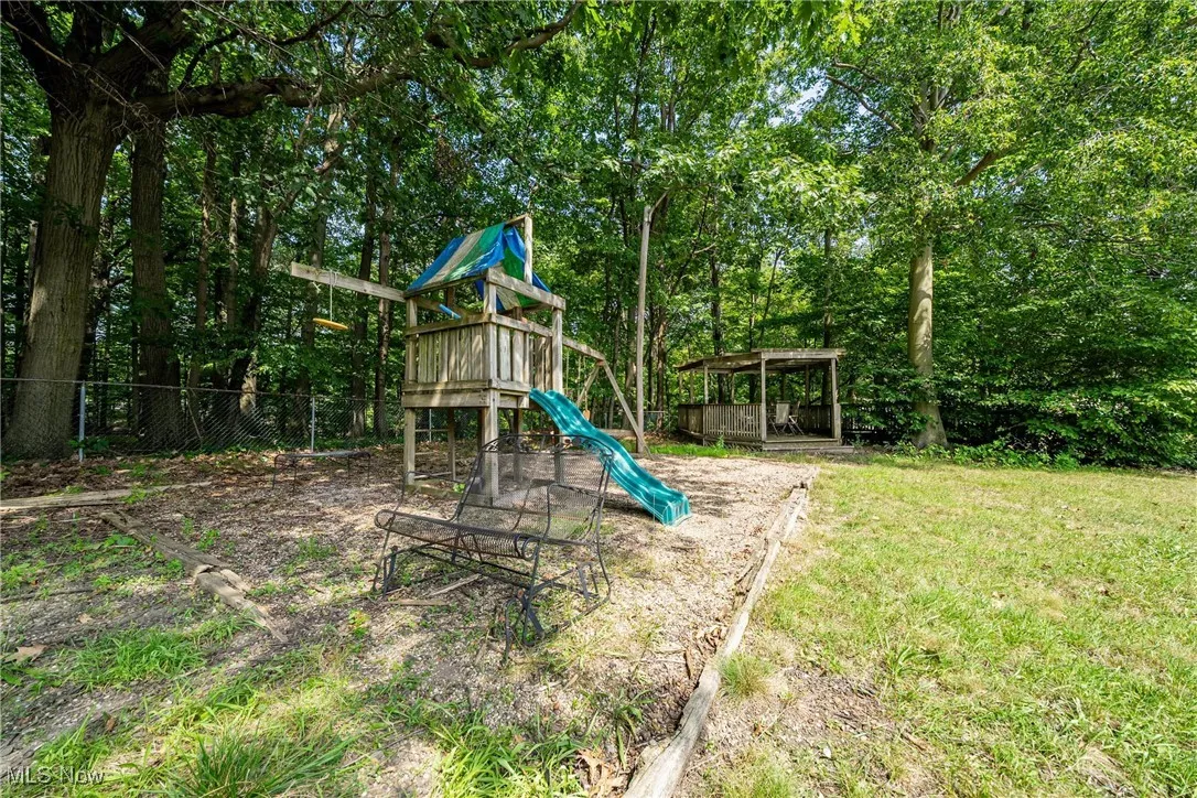 View of playground with view of scattered trees