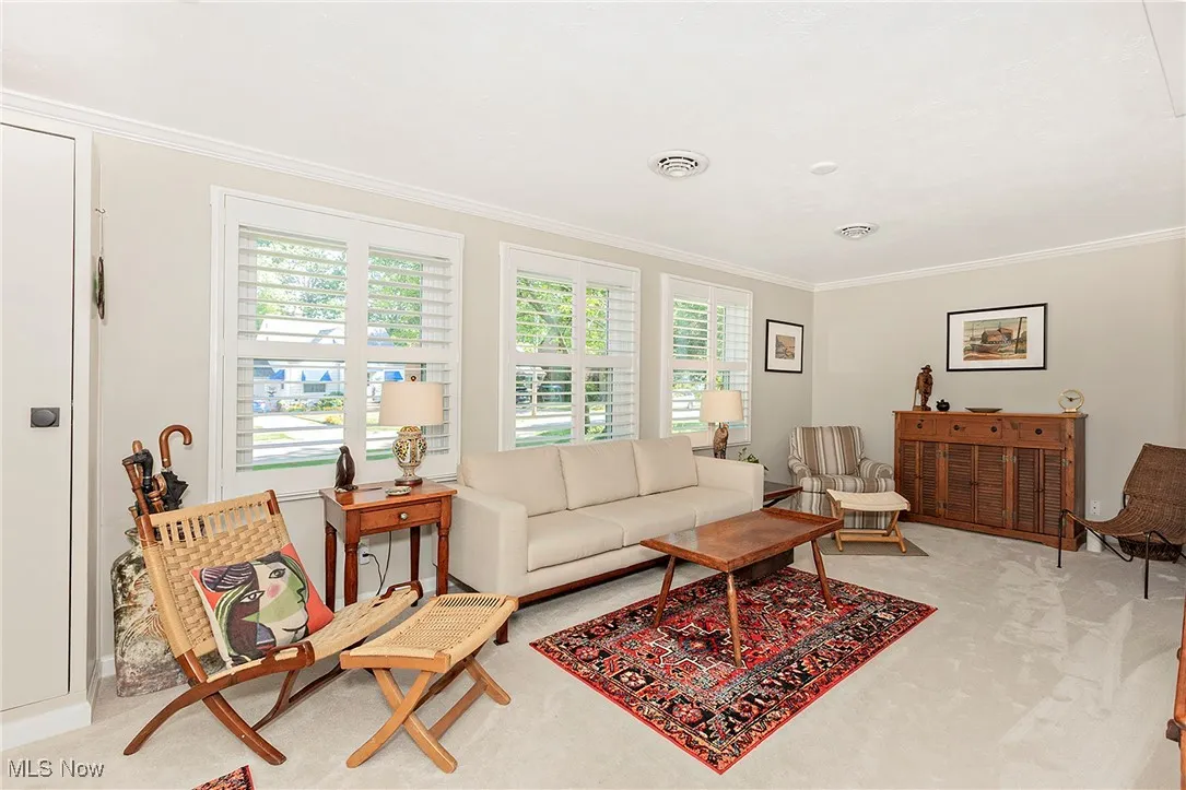 New windows adorned with plantation shutters in the Living Room