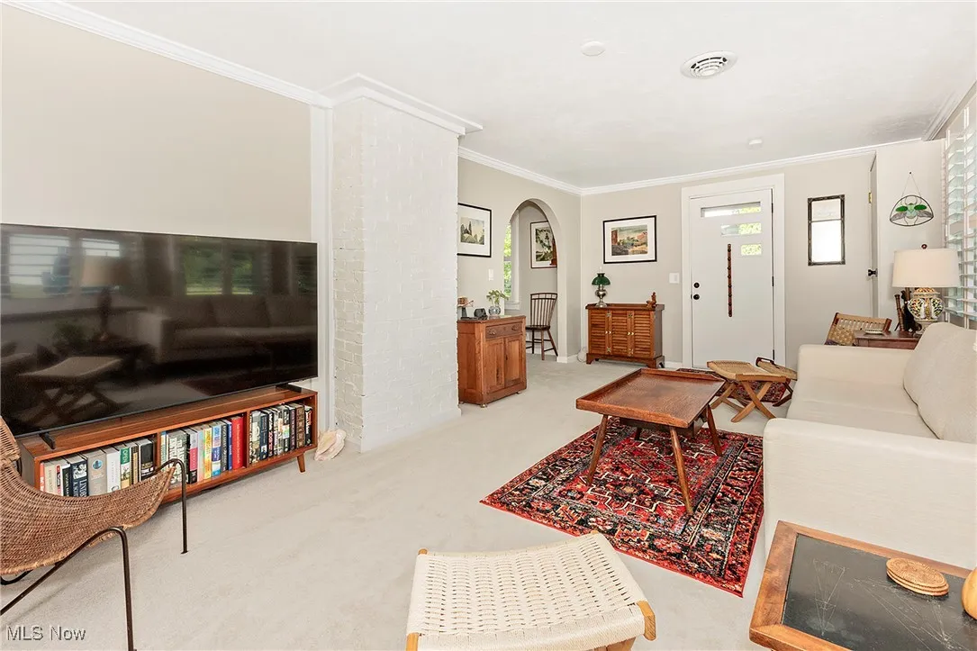 The classic architecture, brick, crown moulding and arch walls add to the appeal and character.