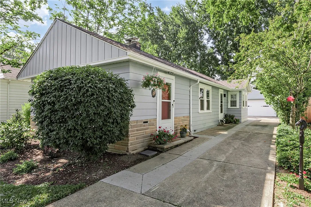 A view of the front door and driveway.