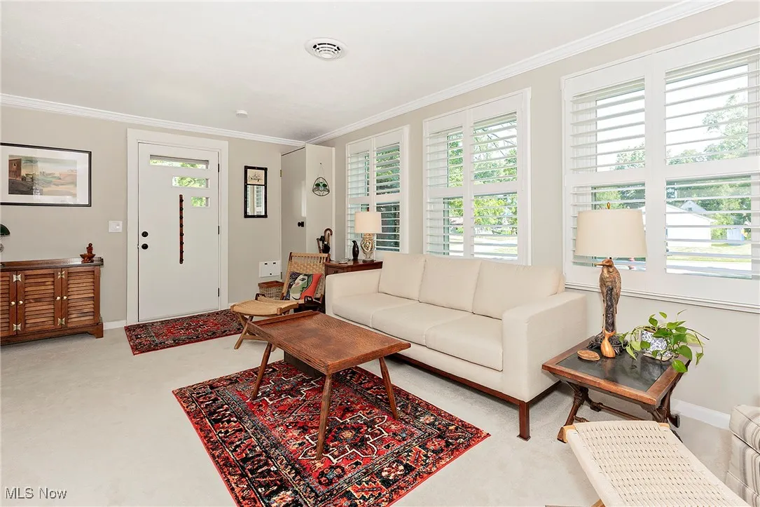 Another nice view of the Living Room, front door and abundant natural light.