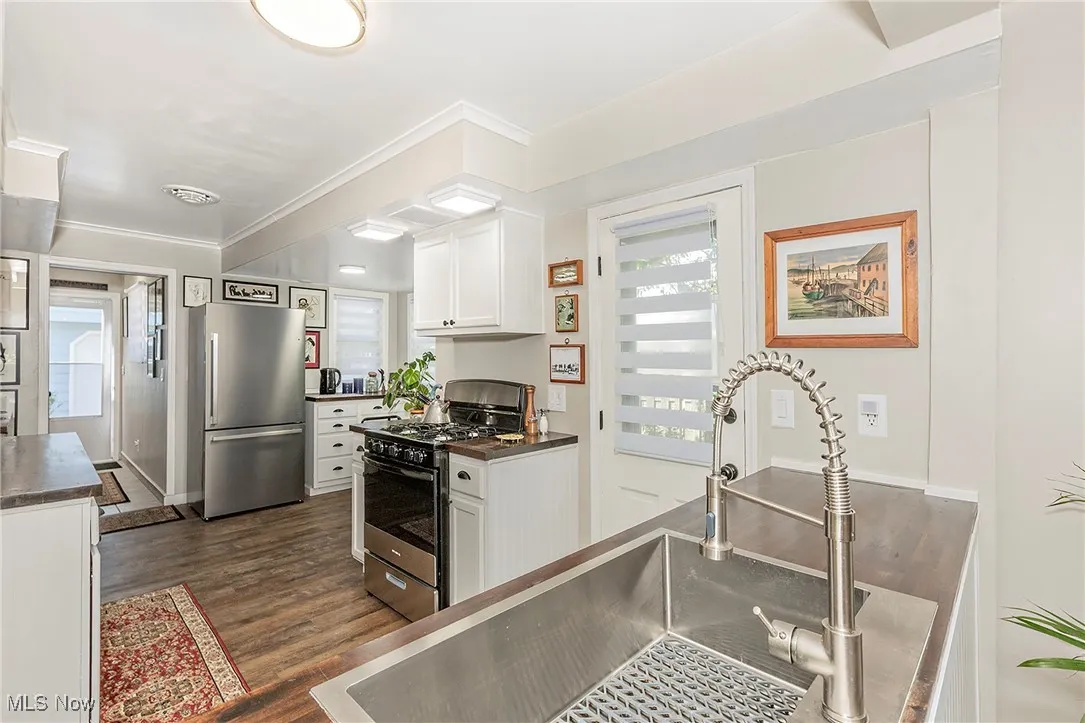 The renovated kitchen has been thoughtfully organized with custom finishes.