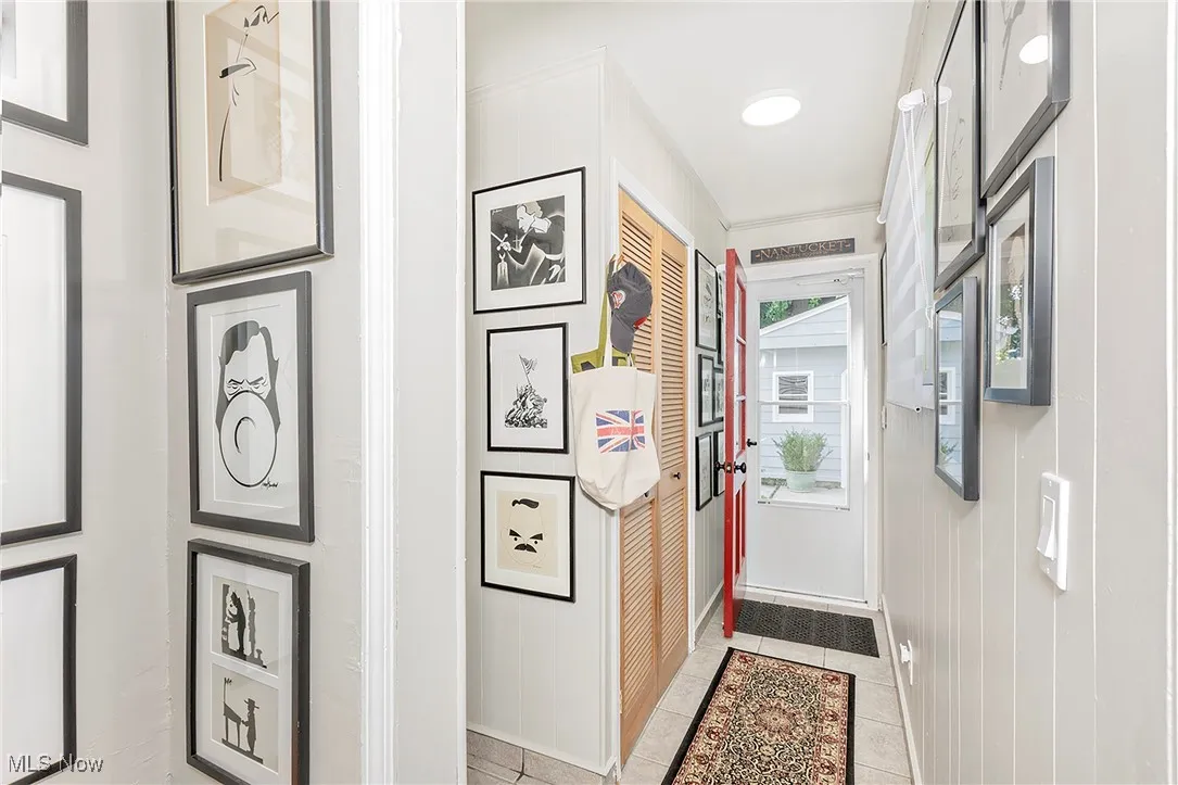 The rear hall features paneling and custom closet pantry.