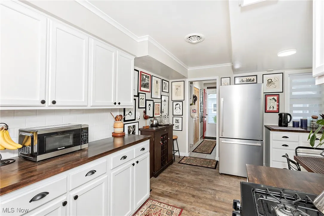New cabinetry, butcher block counters, stainless steel appliances, including a gas stove are simply 