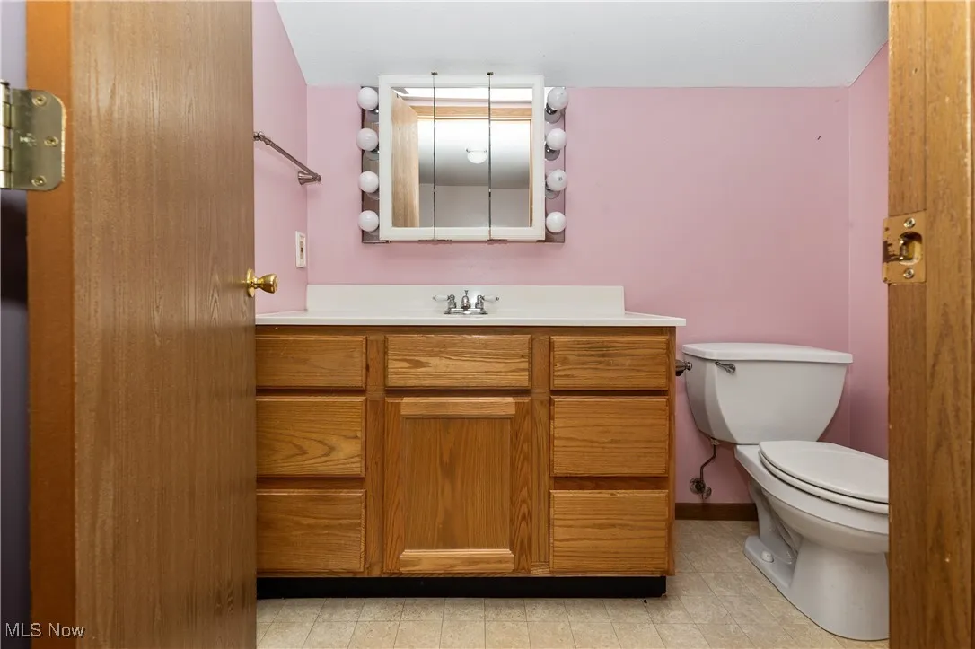 Bathroom with vanity and toilet