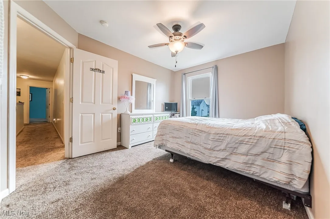 Bedroom featuring carpet flooring and a ceiling fan