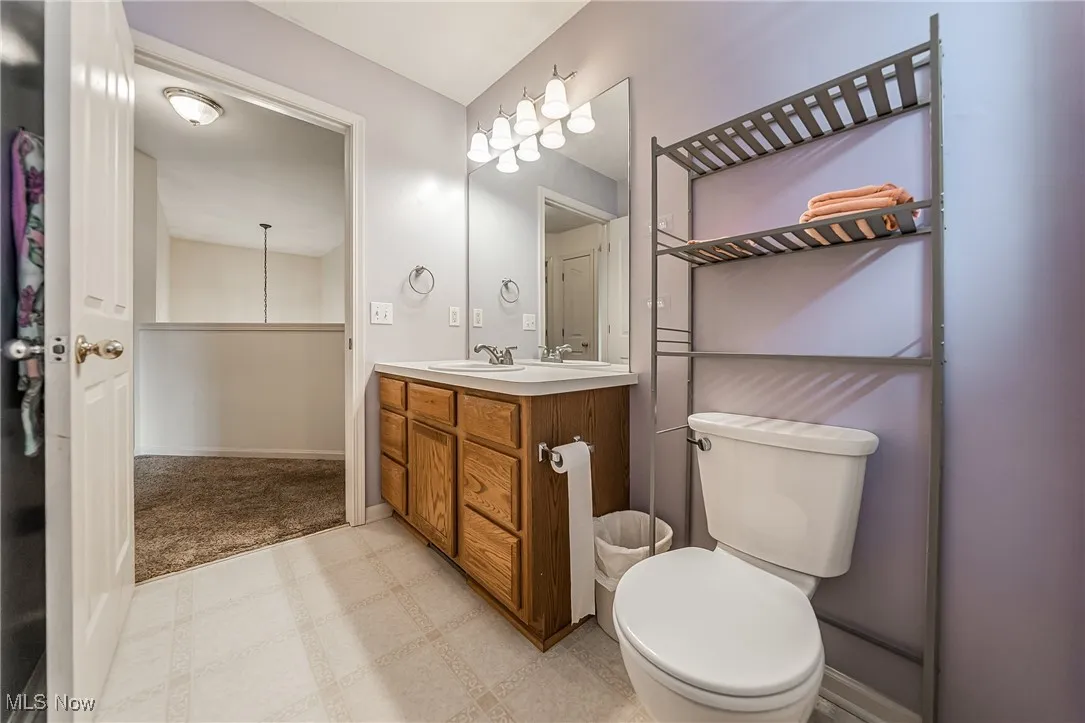 Bathroom featuring vanity and tile patterned floors