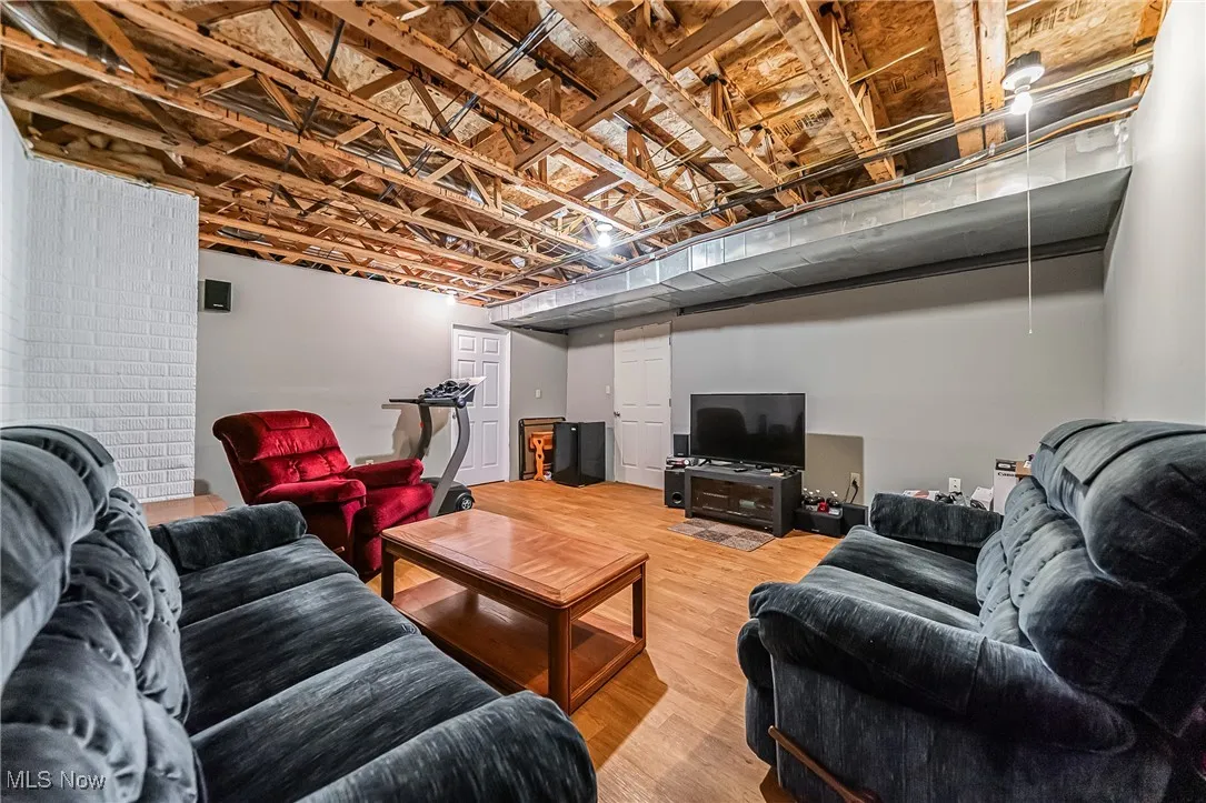 Living room with light wood-style flooring