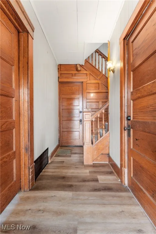 Hall with entry to main level apt and bathroom