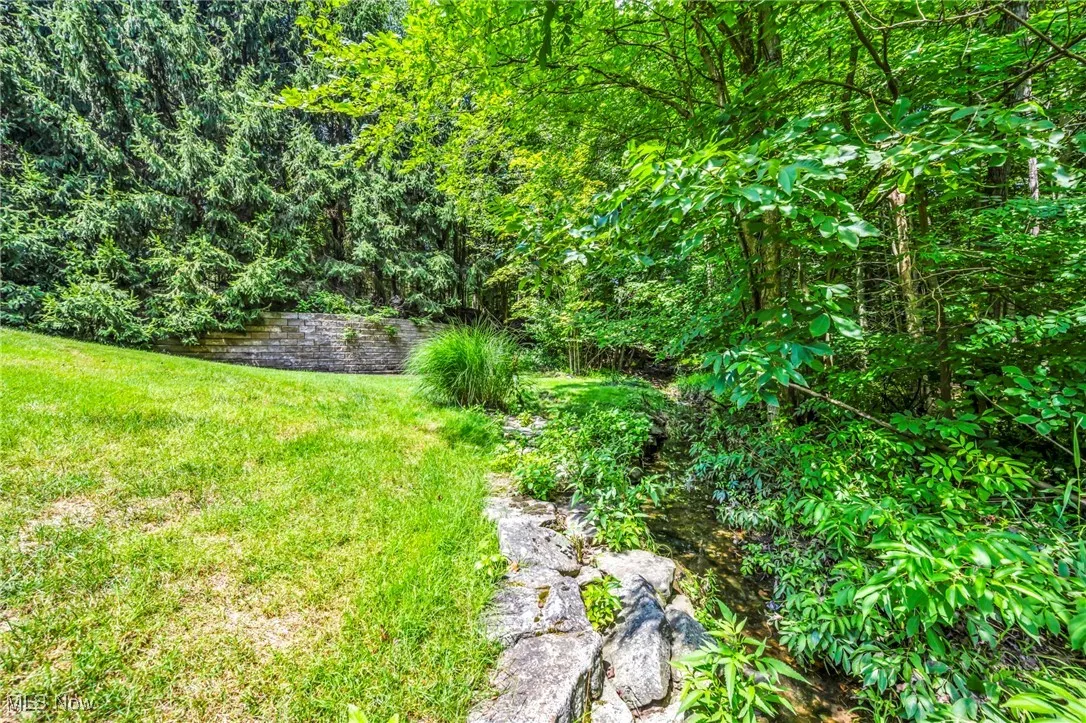 View of green lawn with a water view