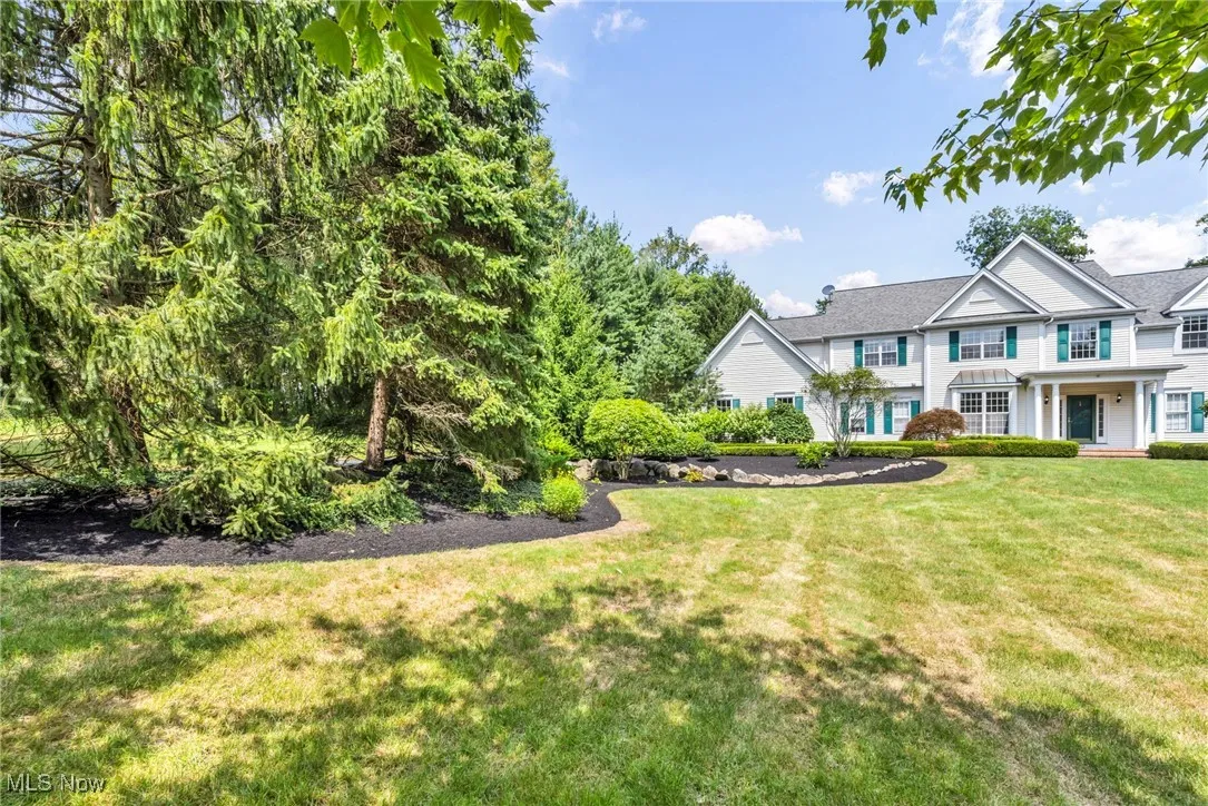 View of front of property with a front yard