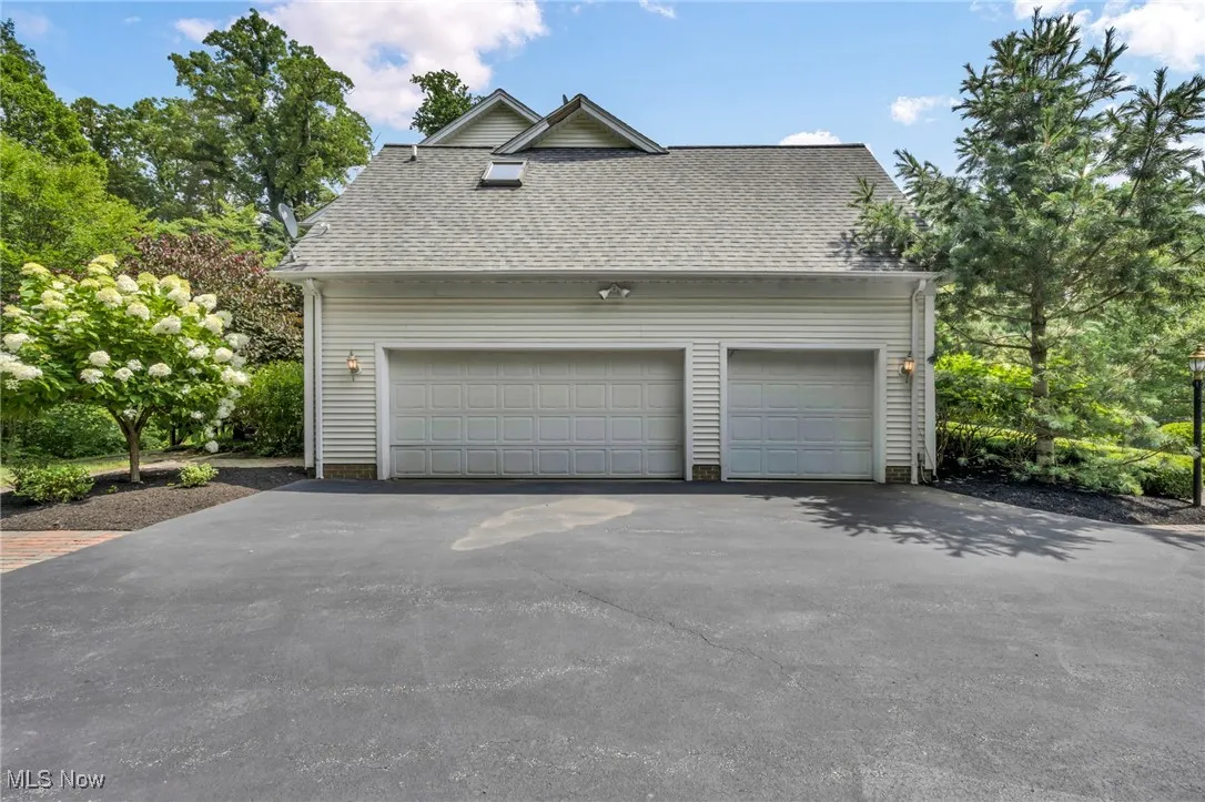 Garage with asphalt driveway