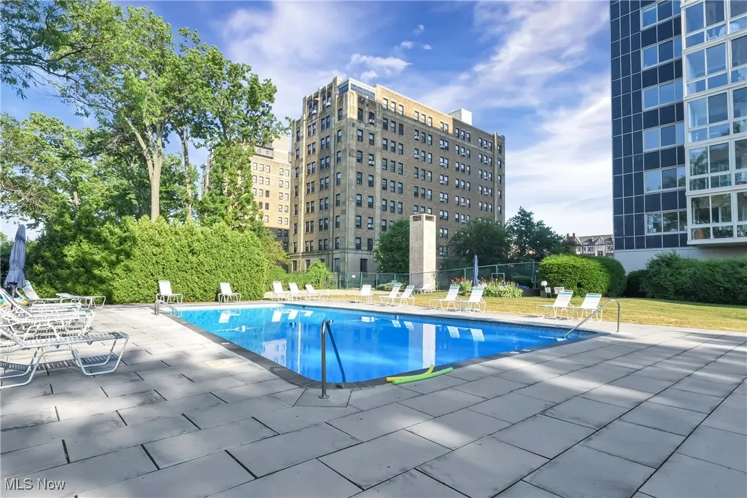 Community pool with a patio area