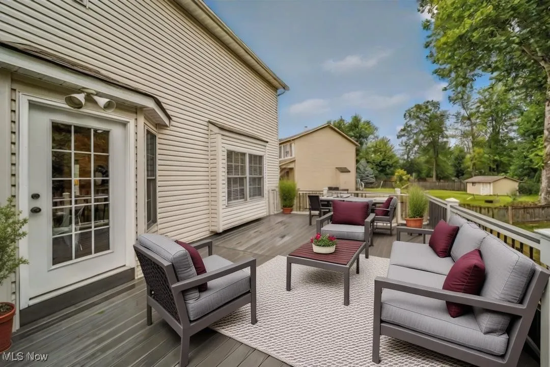 Spacious backyard deck. Virtually staged.