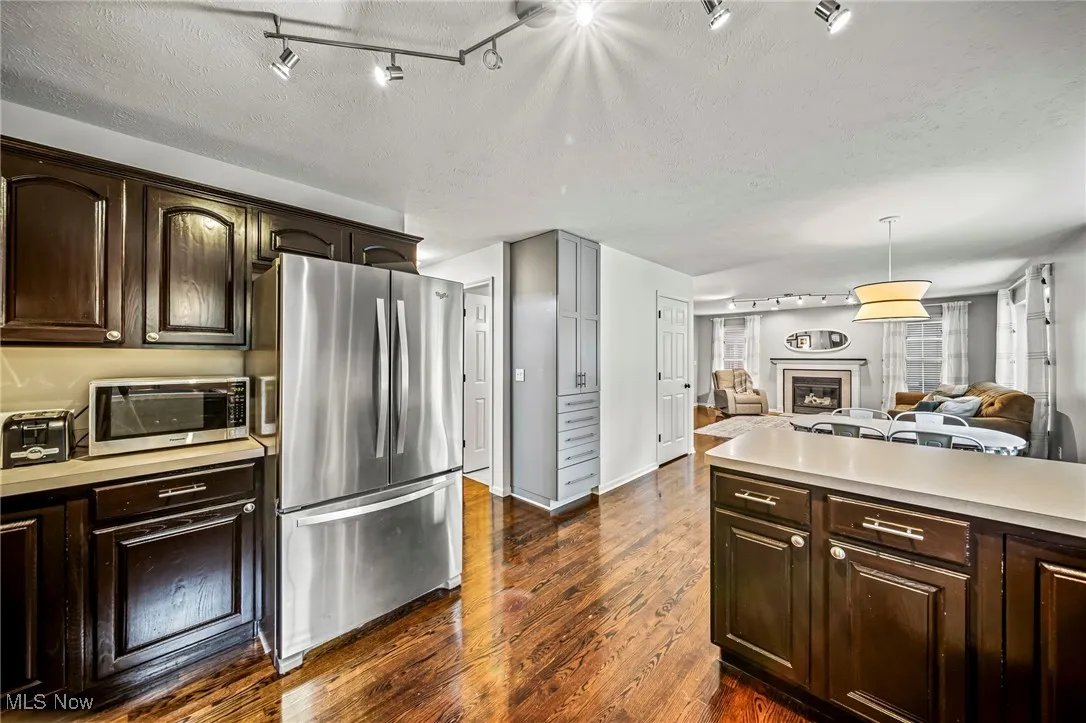 Features convenient built-in shelving with slow-close doors.