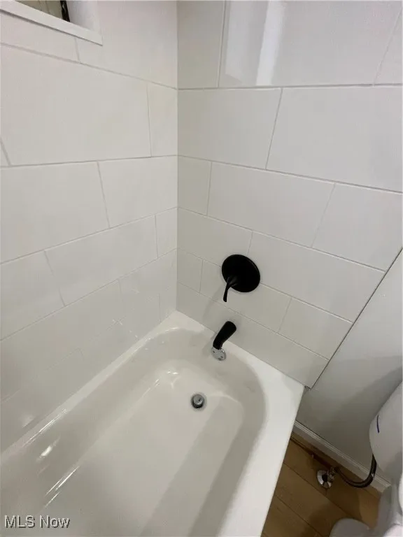 Full bath with a tub to relax in and toilet