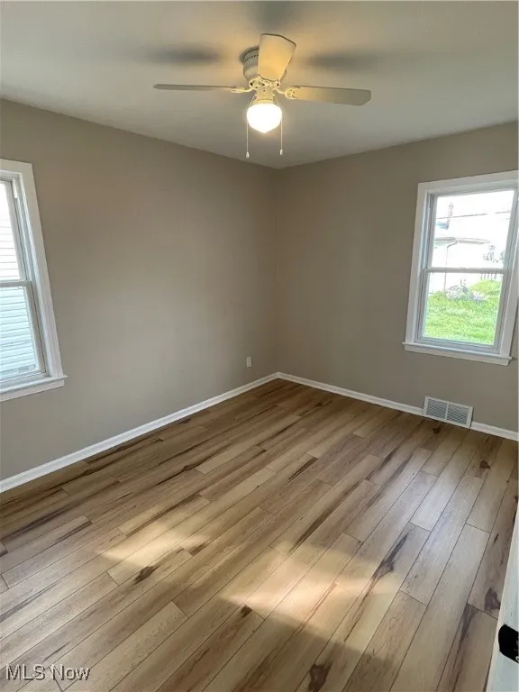 Empty room with wood finished floors