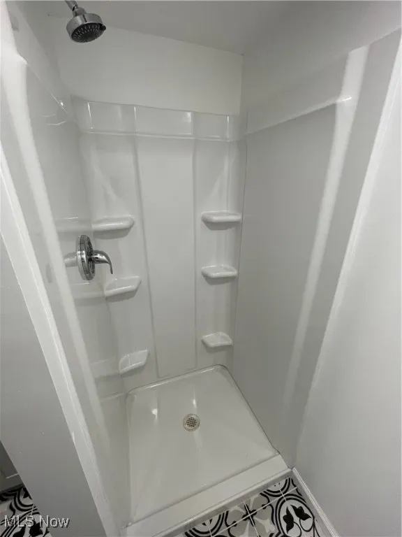 Bathroom featuring a shower stall