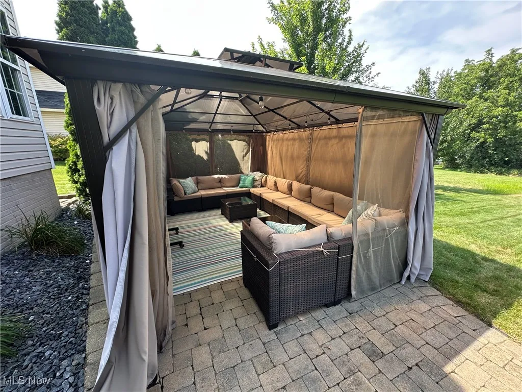 View of patio / terrace with a gazebo and outdoor lounge area