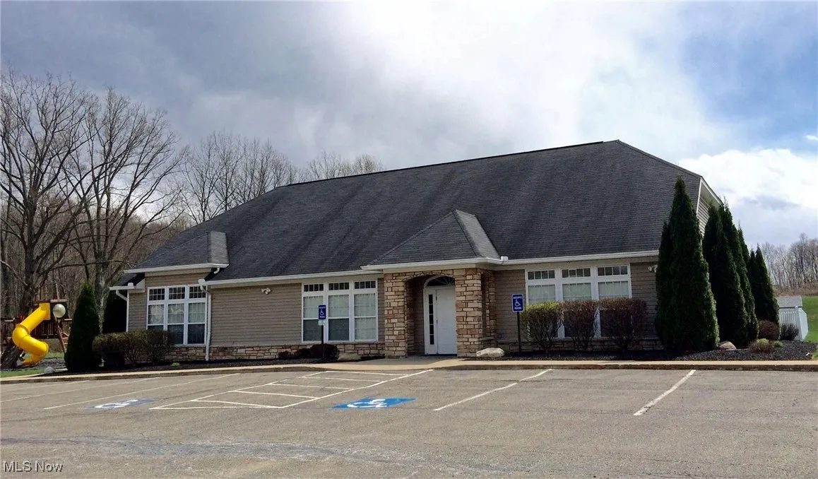 Clubhouse with uncovered parking