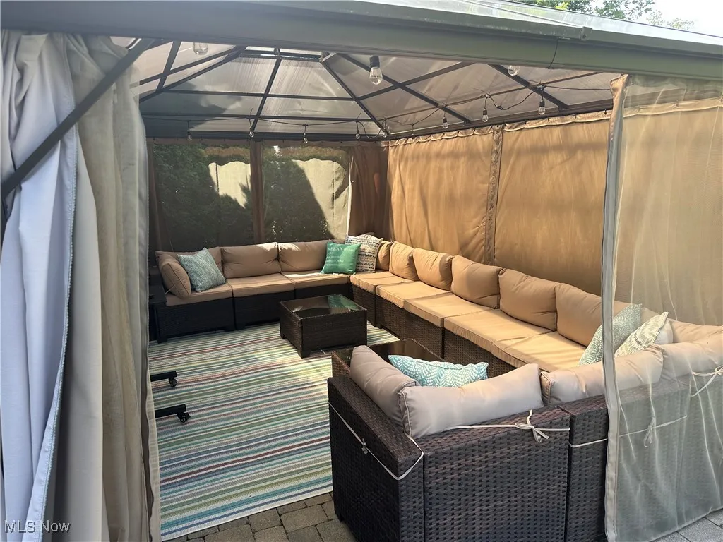 View of patio / terrace featuring outdoor lounge area and a gazebo