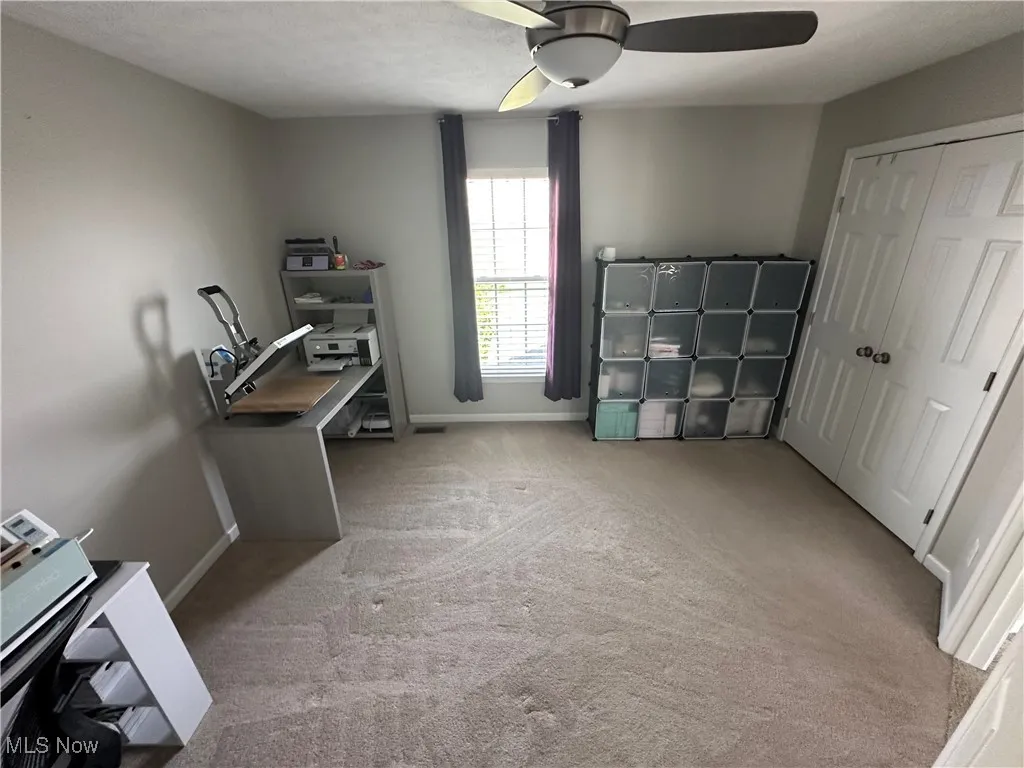  Bedroom with carpet, a ceiling fan, and a textured ceiling