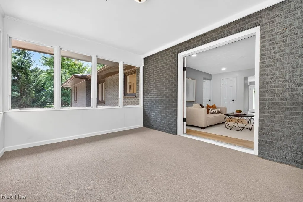 Unfurnished room with carpet floors