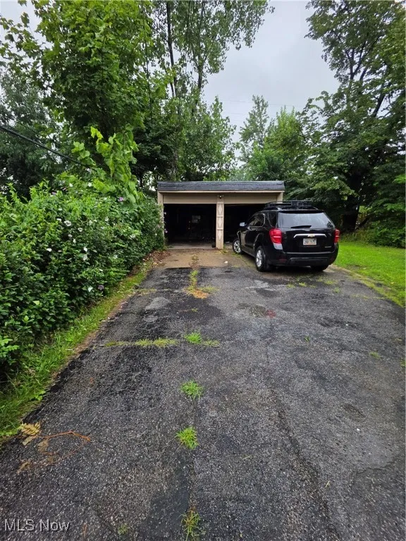View of car parking with a garage
