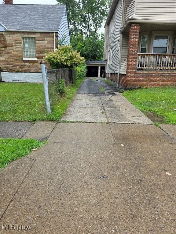 View of side of property with a chimney
