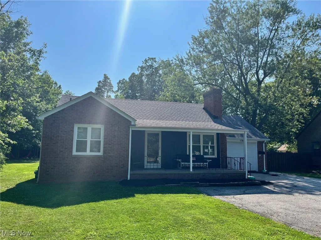 WELCOME HOME to this 
Ranch-style brick home on .66 acres !