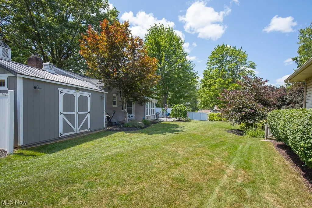 View of yard with a shed