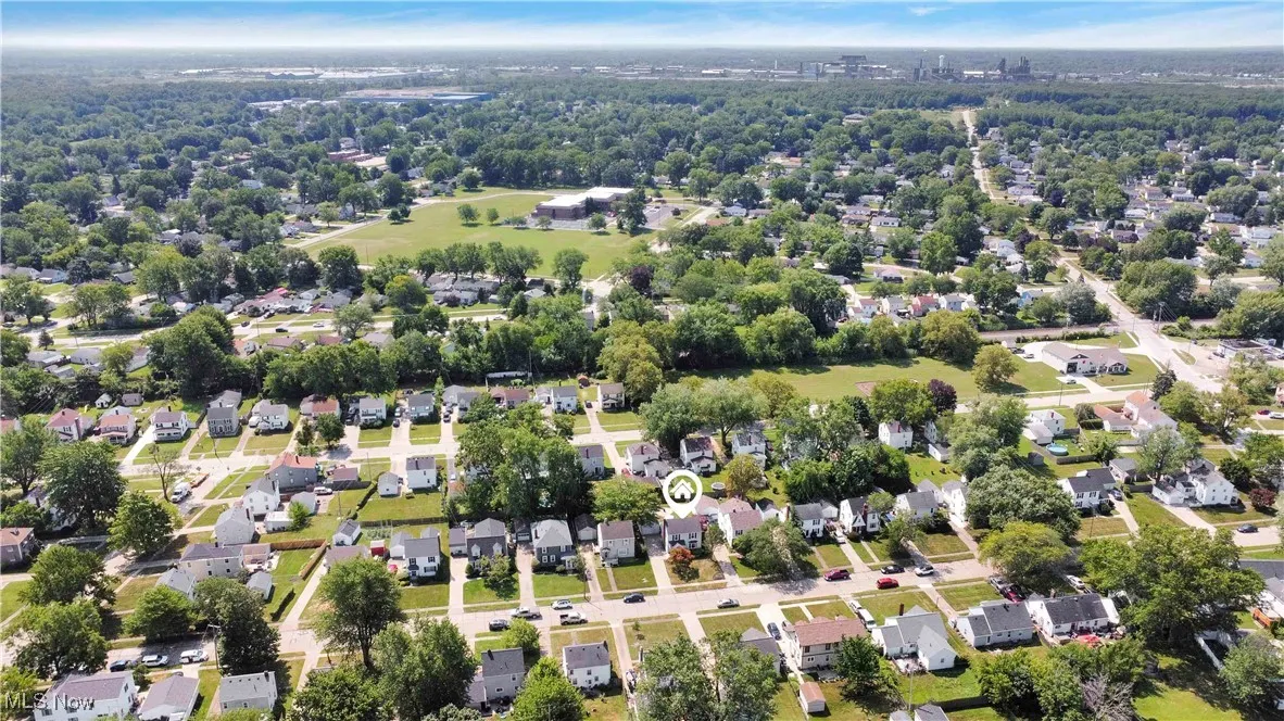 Aerial view of residential area with a tree filled landscape