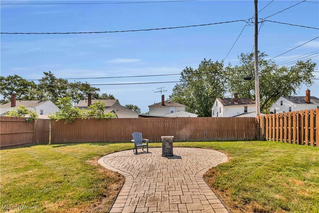 Fenced backyard featuring a patio