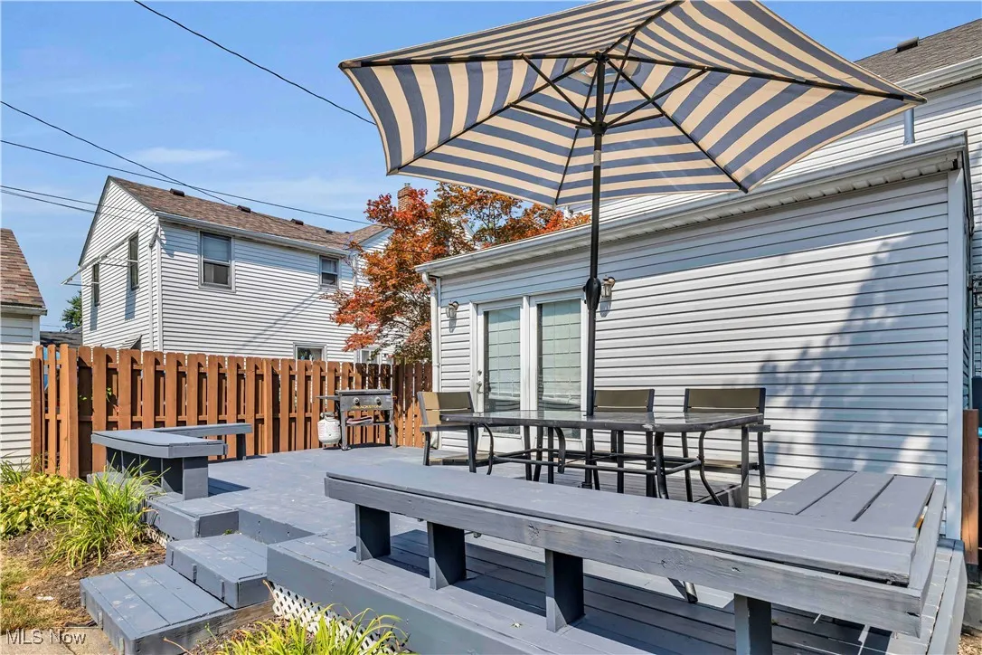 Wooden terrace featuring outdoor dining space