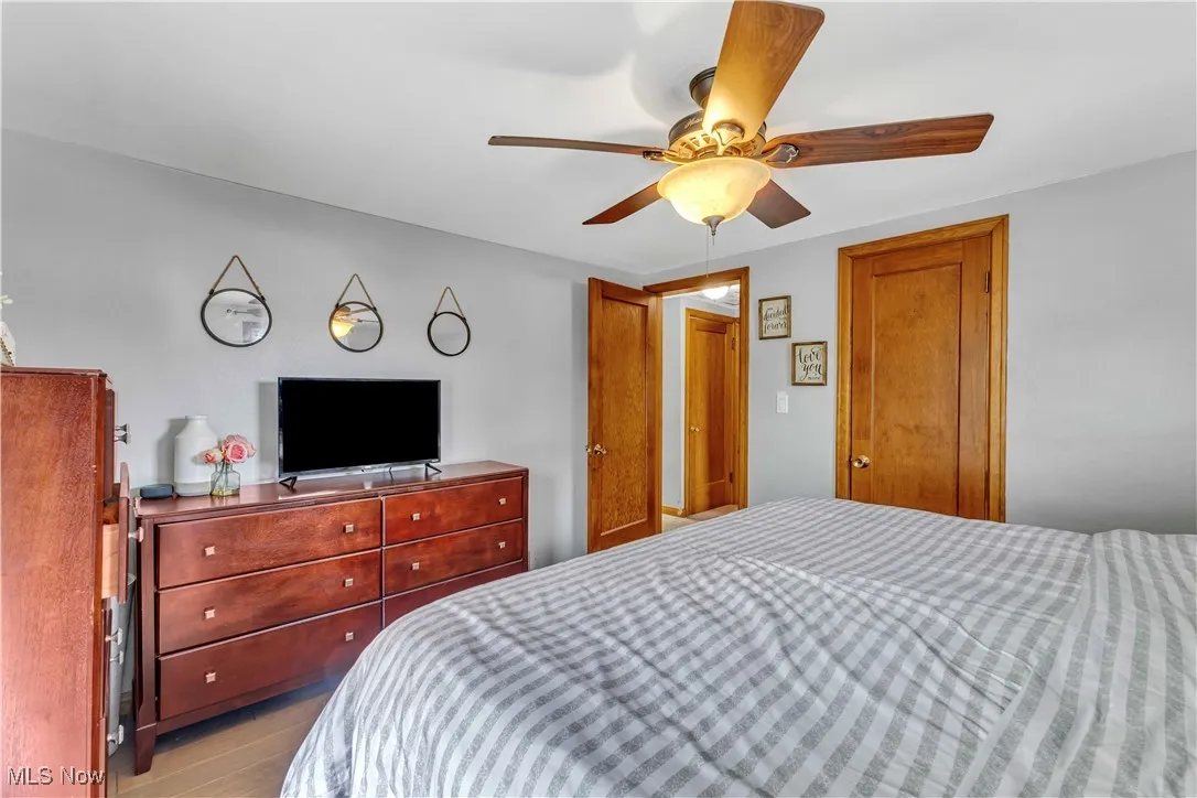 Bedroom with light wood-type flooring and ceiling fan