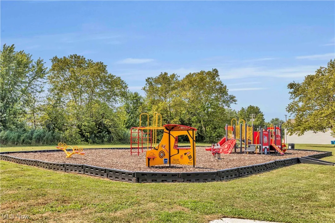 Community play area featuring a lawn