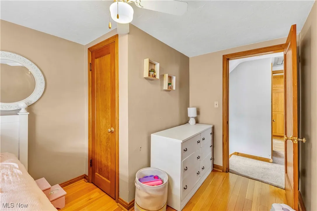 Bedroom featuring light wood-type flooring and baseboards