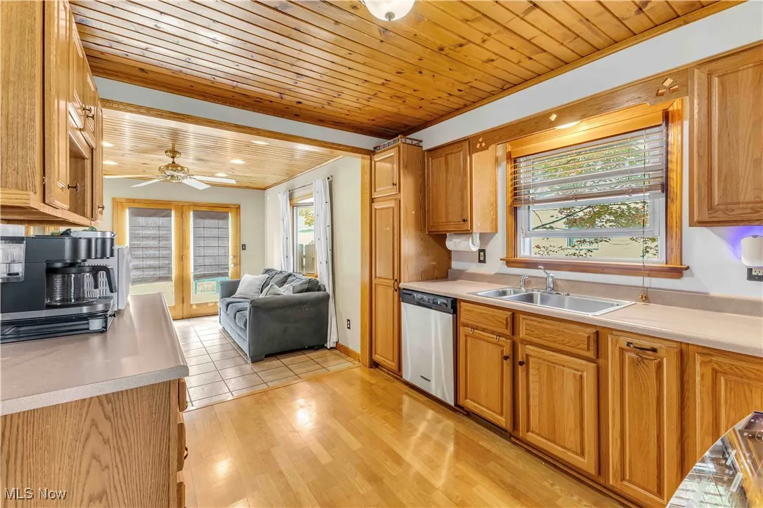 Kitchen featuring wooden ceiling, light wood finished floors, healthy amount of natural light, and light countertops
