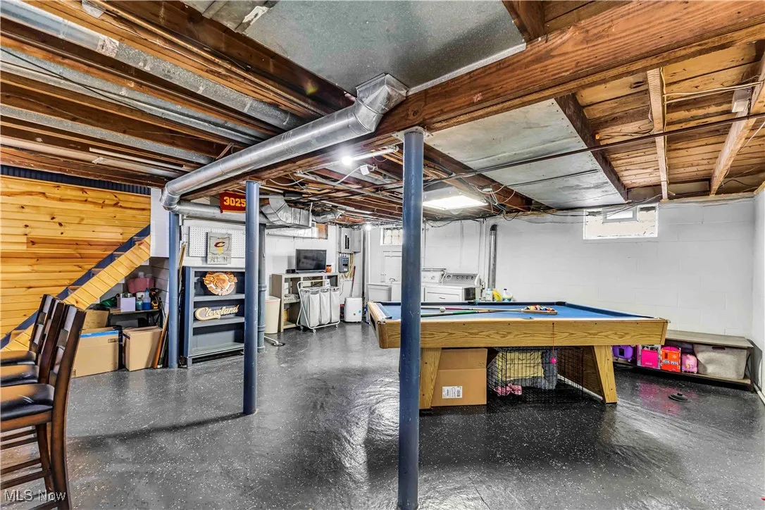 Below grade area featuring pool table and tile patterned floors