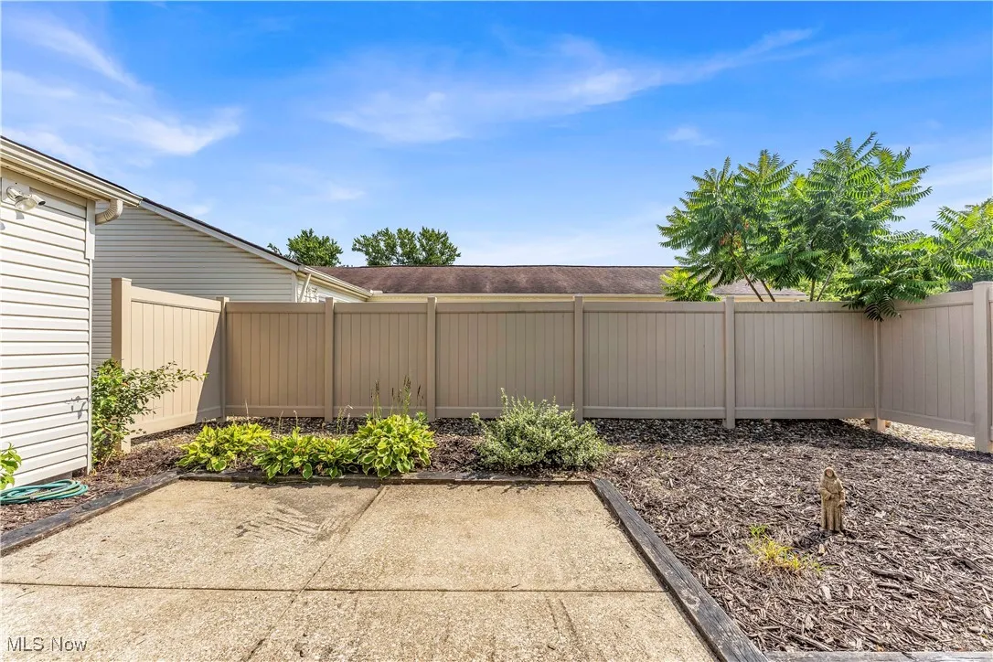 Fenced backyard with a patio area