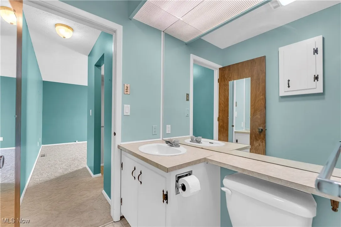 Bathroom featuring toilet and vanity