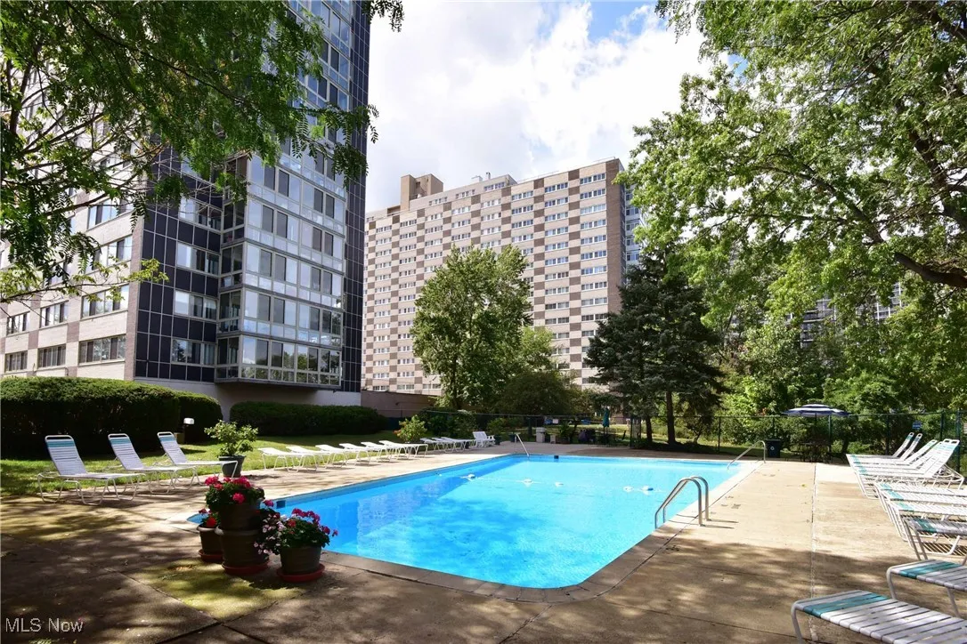 Community pool with a patio